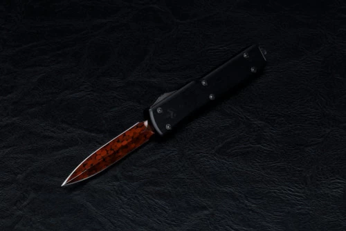 Marfione Custom Knives UTX-70 OTF Knife Hot Blued Reitveld Dragon Skin Pattern Bertie Reitveld Damascus Spike Grind Spike Grind W/ Hefted Alloy And DLC Two-Tone Hardware